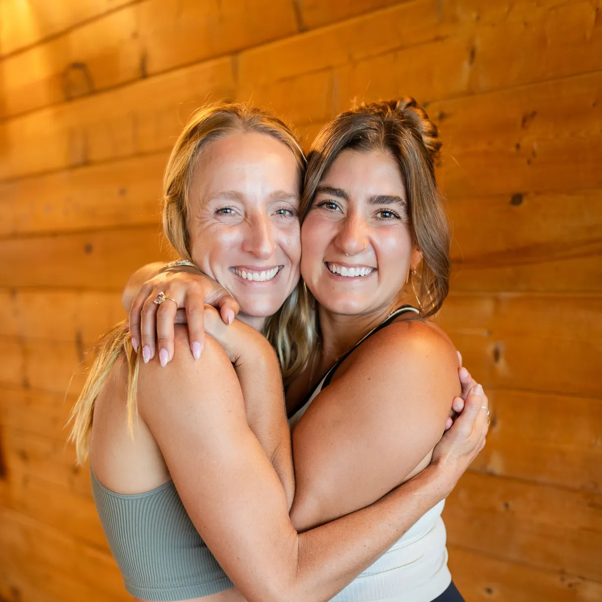 Meg Whitney and Morgan Jaleh Dehmohseni hugging